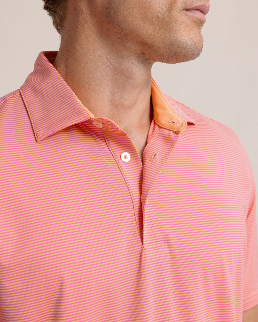 The detail view of the Southern Tide brrr-eeze Meadowbrook Stripe Polo by Southern Tide - Cantaloupe