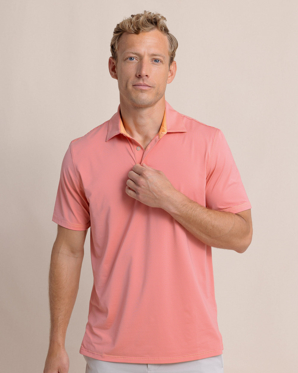 The front view of the Southern Tide brrr-eeze Meadowbrook Stripe Polo by Southern Tide - Cantaloupe