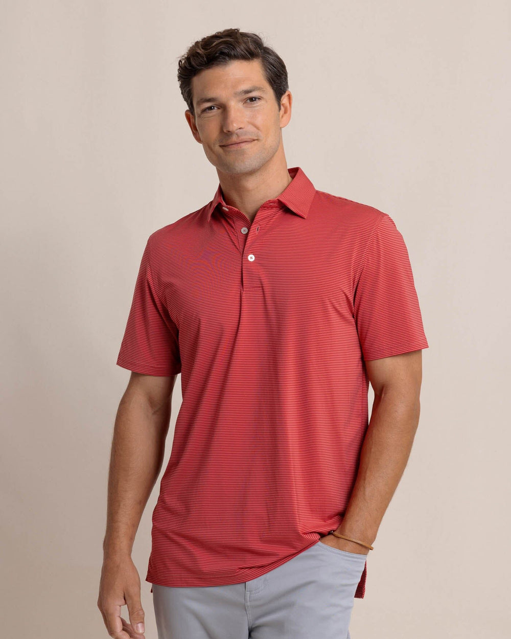 The front view of the Southern Tide brrr-eeze Meadowbrook Stripe Polo by Southern Tide - Mineral Red