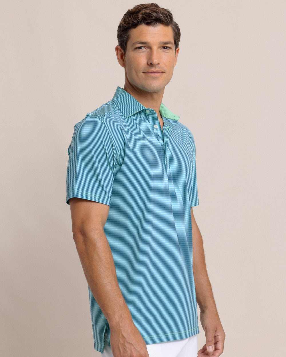 The side view of the Southern Tide brrr-eeze Meadowbrook Stripe Polo by Southern Tide - Parakeet