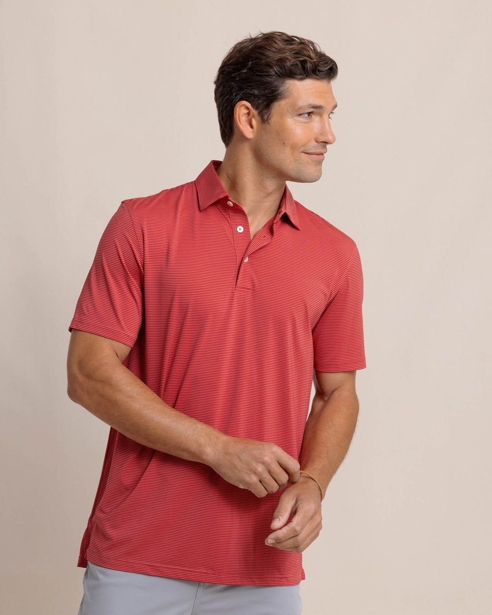 The front view of the Southern Tide brrr-eeze Meadowbrook Stripe Polo by Southern Tide - Mineral Red