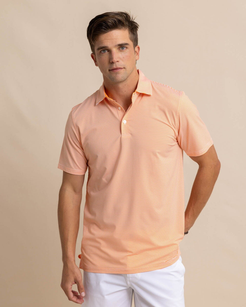 The front view of the Southern Tide brrr-eeze-meadowbrook-stripe-polo by Southern Tide - Tangerine Orange