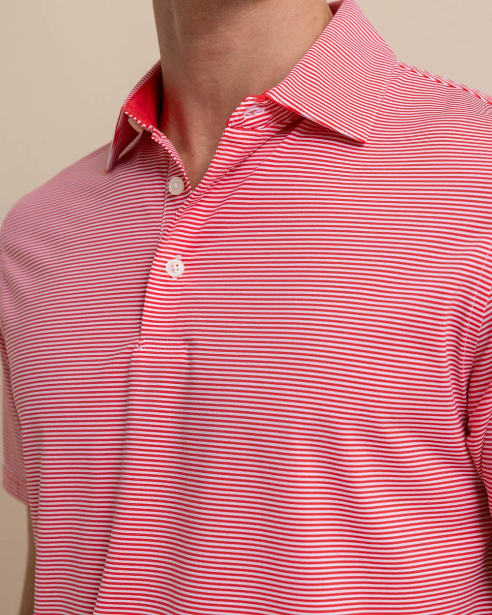 The detail view of the Southern Tide brrr-eeze-meadowbrook-stripe-polo by Southern Tide - Teaberry Pink