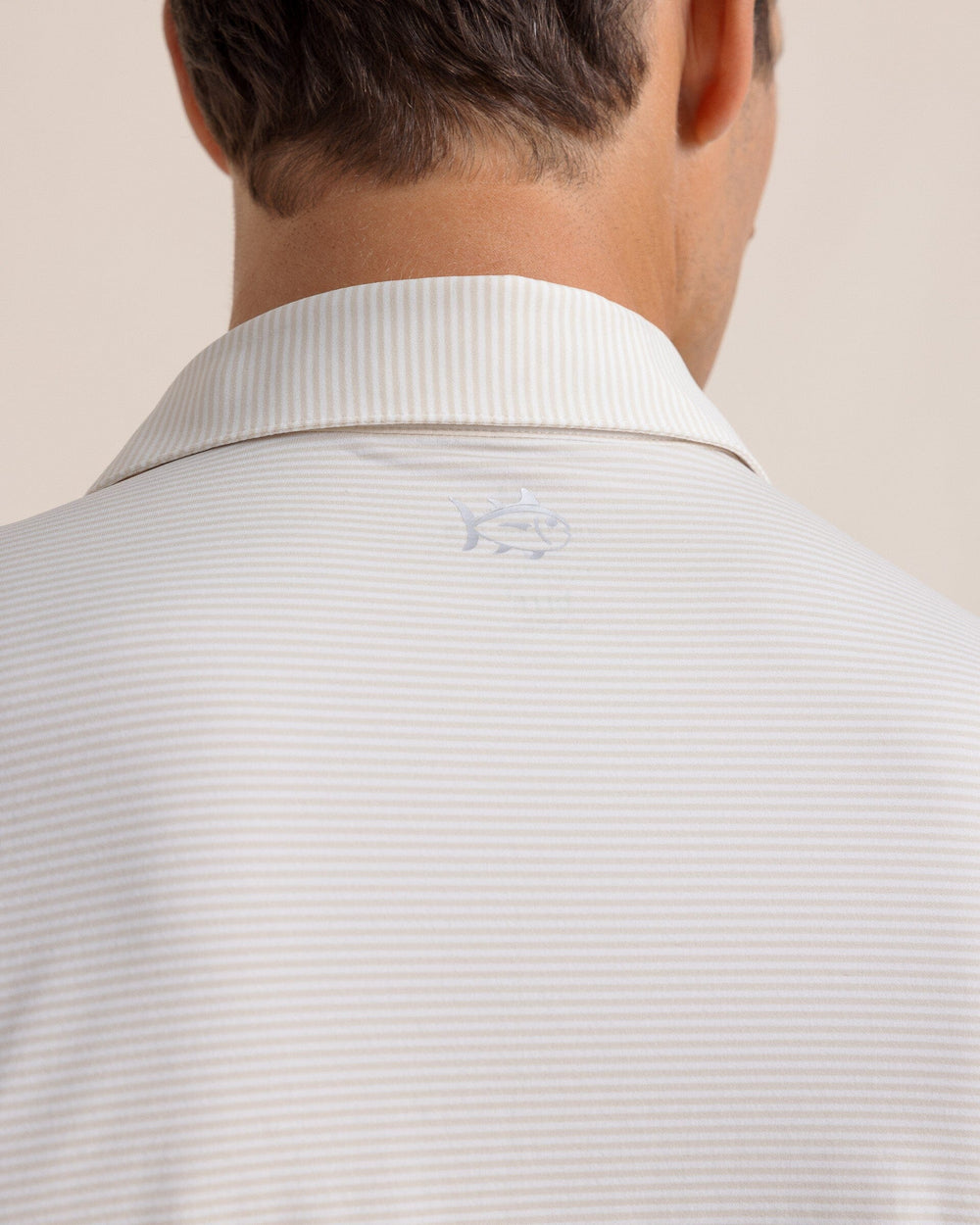 The detail view of the Southern Tide brrr-eeze Meadowbrook Stripe Polo by Southern Tide - Sand White