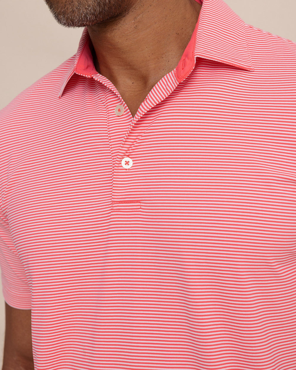 The detail view of the Southern Tide brrr°®-eeze Meadowbrook Stripe Polo by Southern Tide - Snapper
