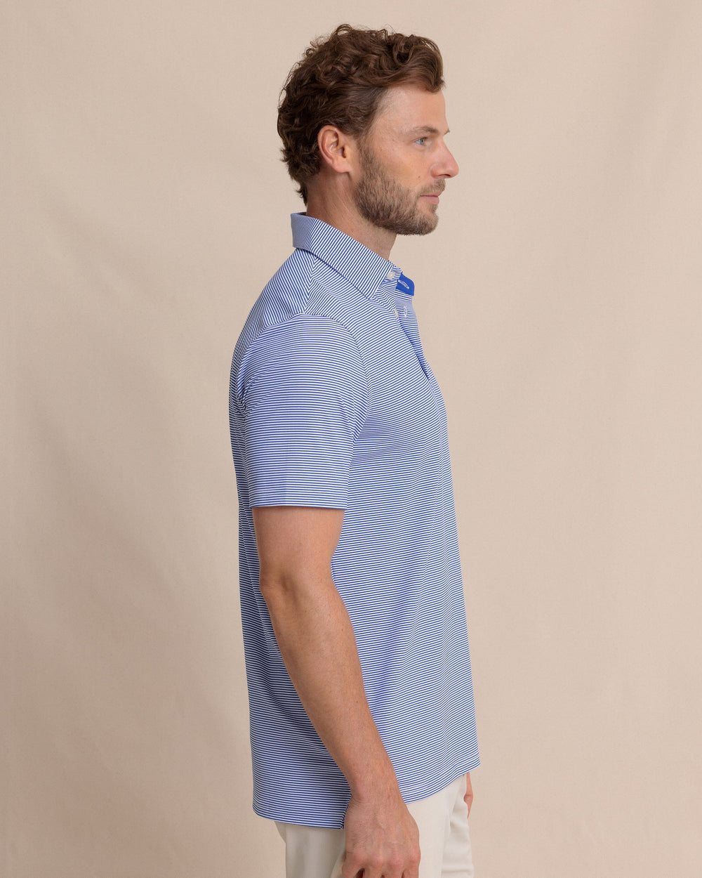 The side view of the Southern Tide brrr°®-eeze Meadowbrook Stripe Polo by Southern Tide - Surf Blue