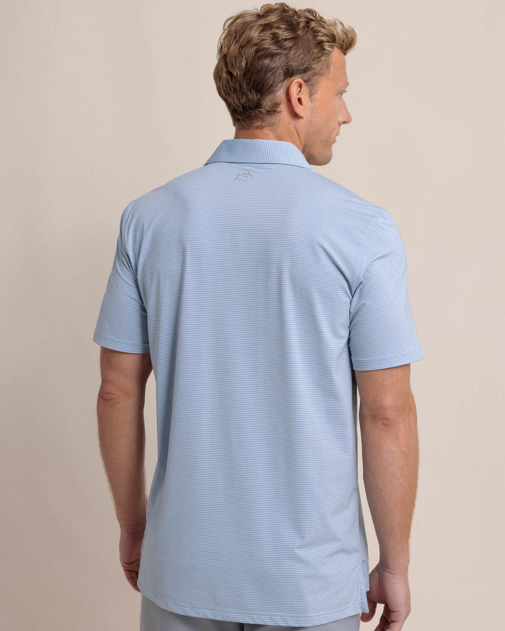 The back view of the Southern Tide brrr-eeze Meadowbrook Stripe Polo by Southern Tide - Triumph Blue