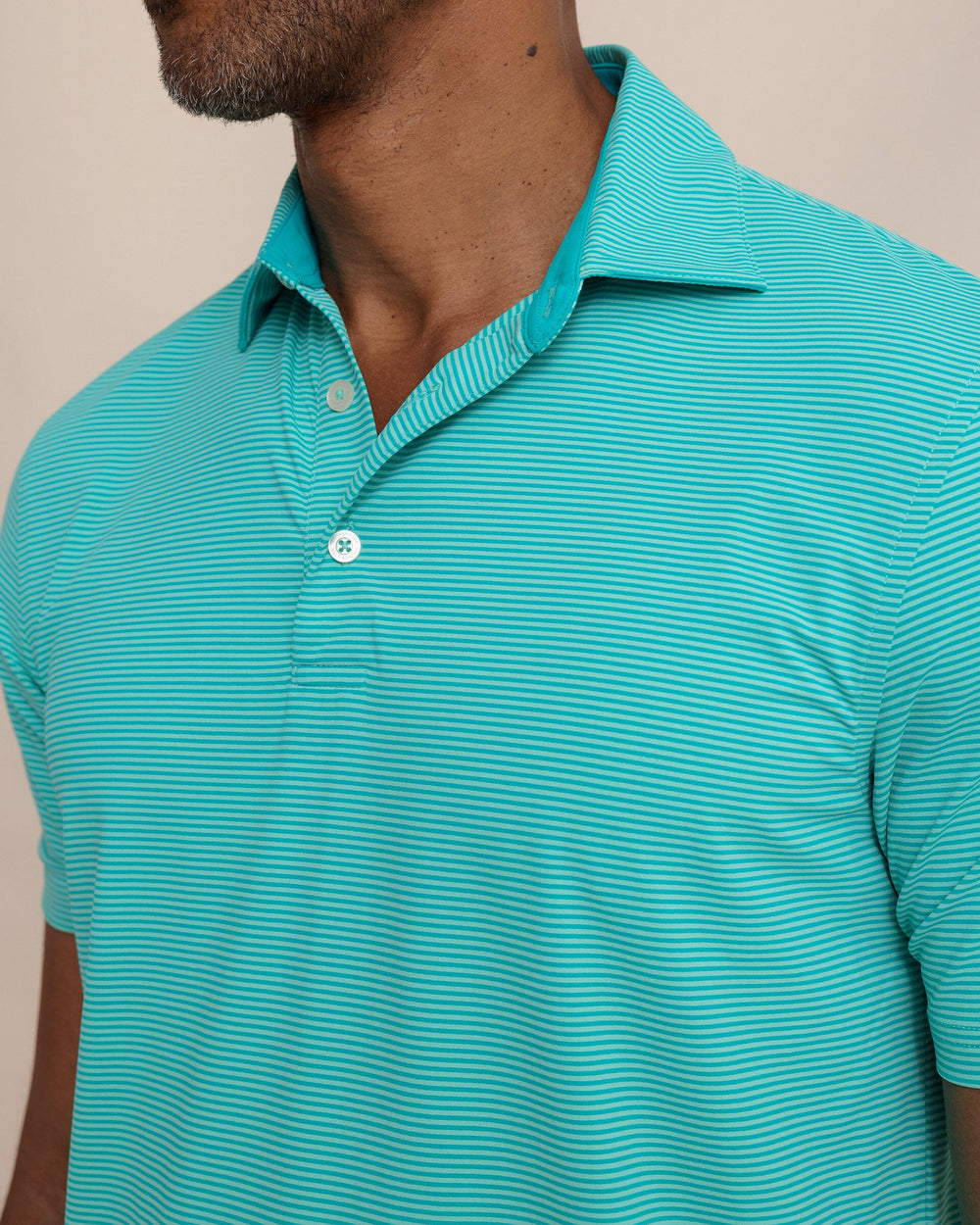 The detail view of the Southern Tide brrr°®-eeze Meadowbrook Stripe Polo by Southern Tide - Turtle Green