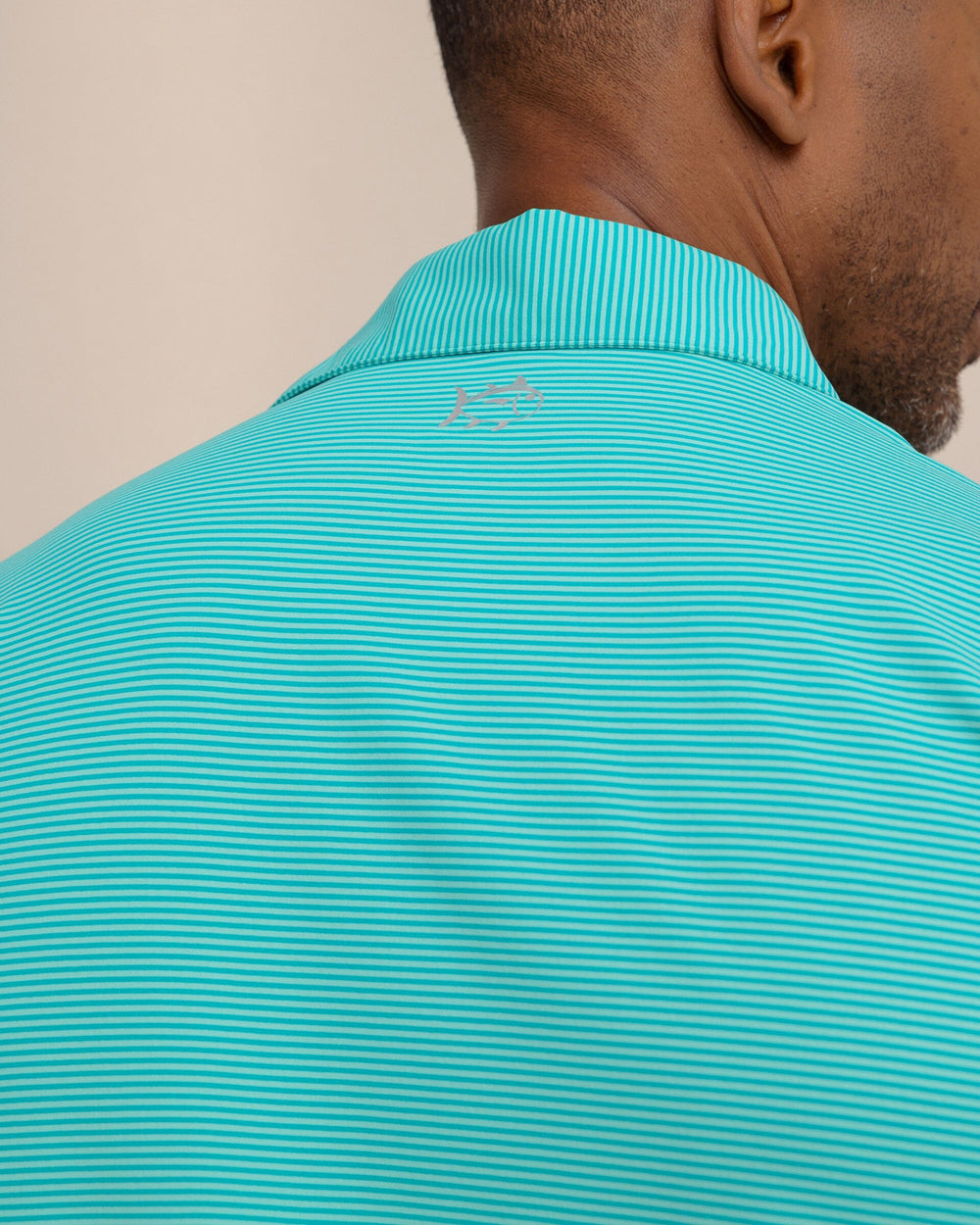The detail view of the Southern Tide brrr°®-eeze Meadowbrook Stripe Polo by Southern Tide - Turtle Green