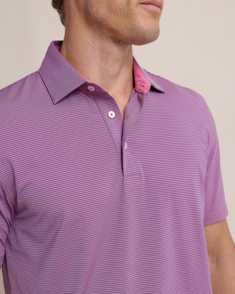 The detail view of the Southern Tide brrr-eeze Meadowbrook Stripe Polo by Southern Tide - Very Berry