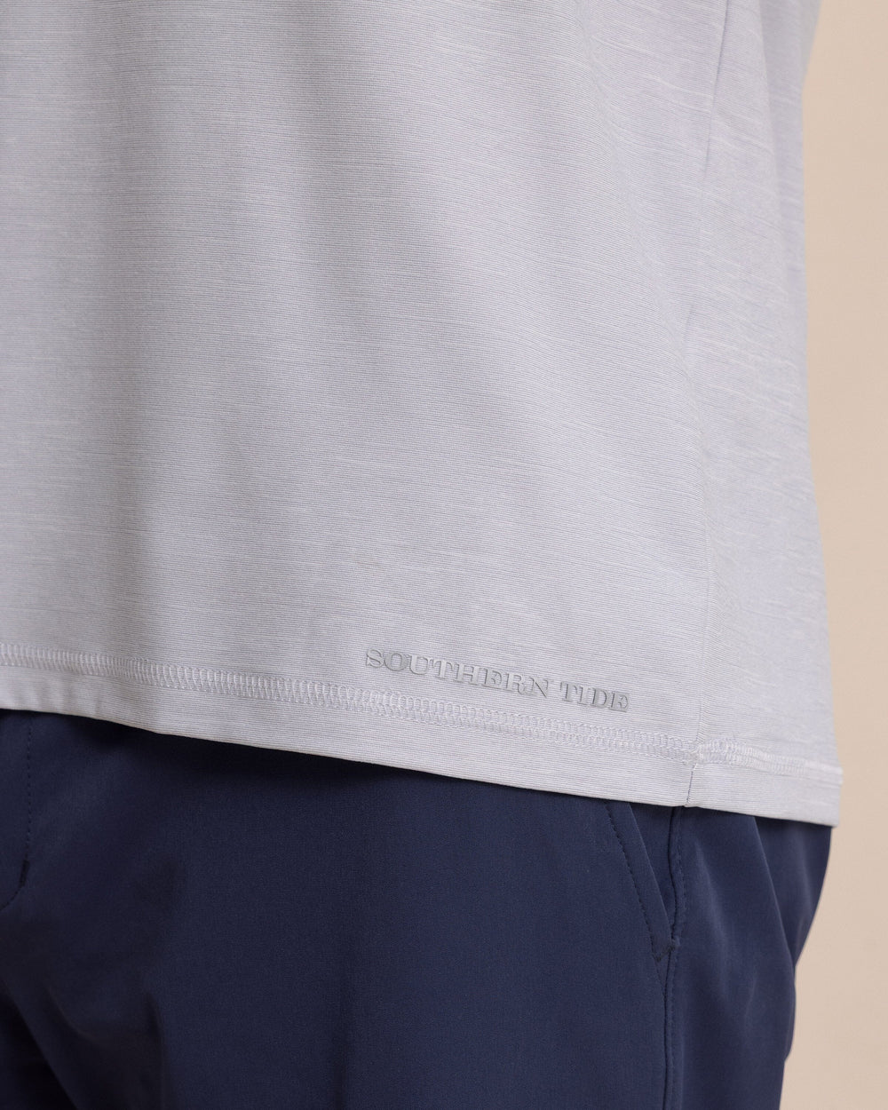 The detail view of the Southern Tide brrr°®-illiant Performance Hoodie by Southern Tide - Platinum Grey