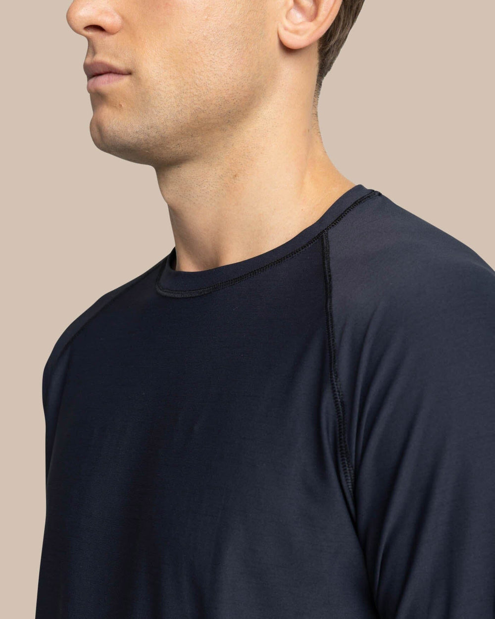The detail view of the Southern Tide brrr-illiant Performance Long Sleeve T-Shirt by Southern Tide - Caviar Black