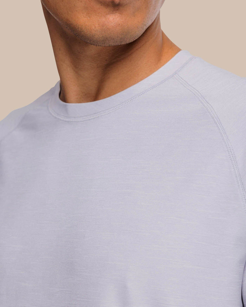 The detail view of the Southern Tide brrr-illiant Performance Long Sleeve Tee by Southern Tide - Platinum Grey