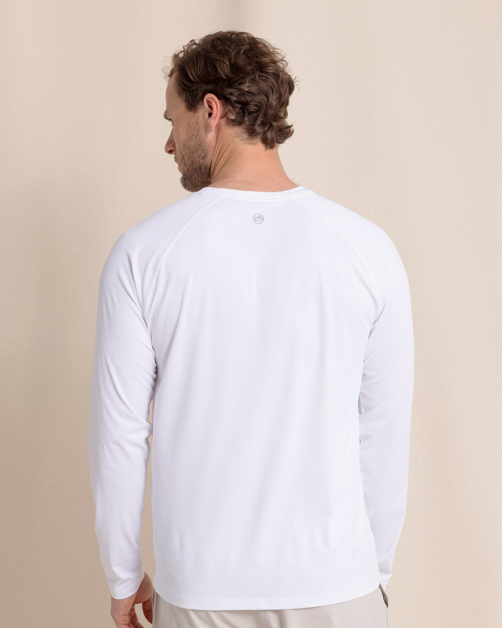 The back view of the Southern Tide brrr°®-illiant Performance Long Sleeve T-Shirt by Southern Tide - Classic White