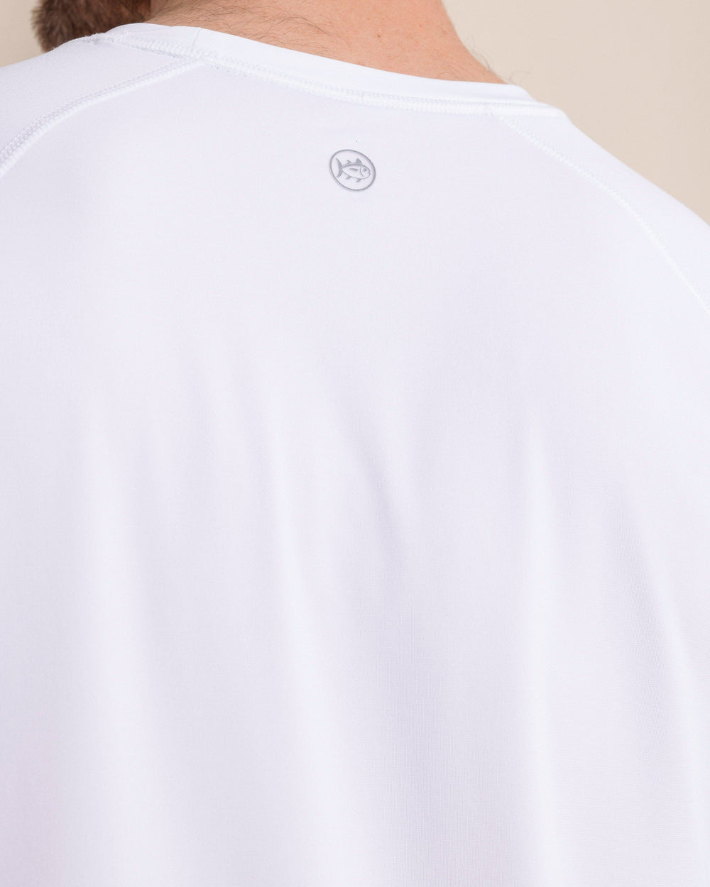 The back detail view of the Southern Tide brrr°®-illiant Performance Long Sleeve T-Shirt by Southern Tide - Classic White