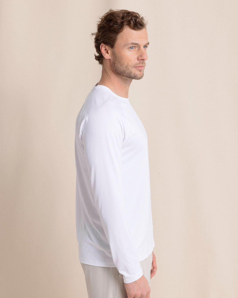 The side view of the Southern Tide brrr°®-illiant Performance Long Sleeve T-Shirt by Southern Tide - Classic White