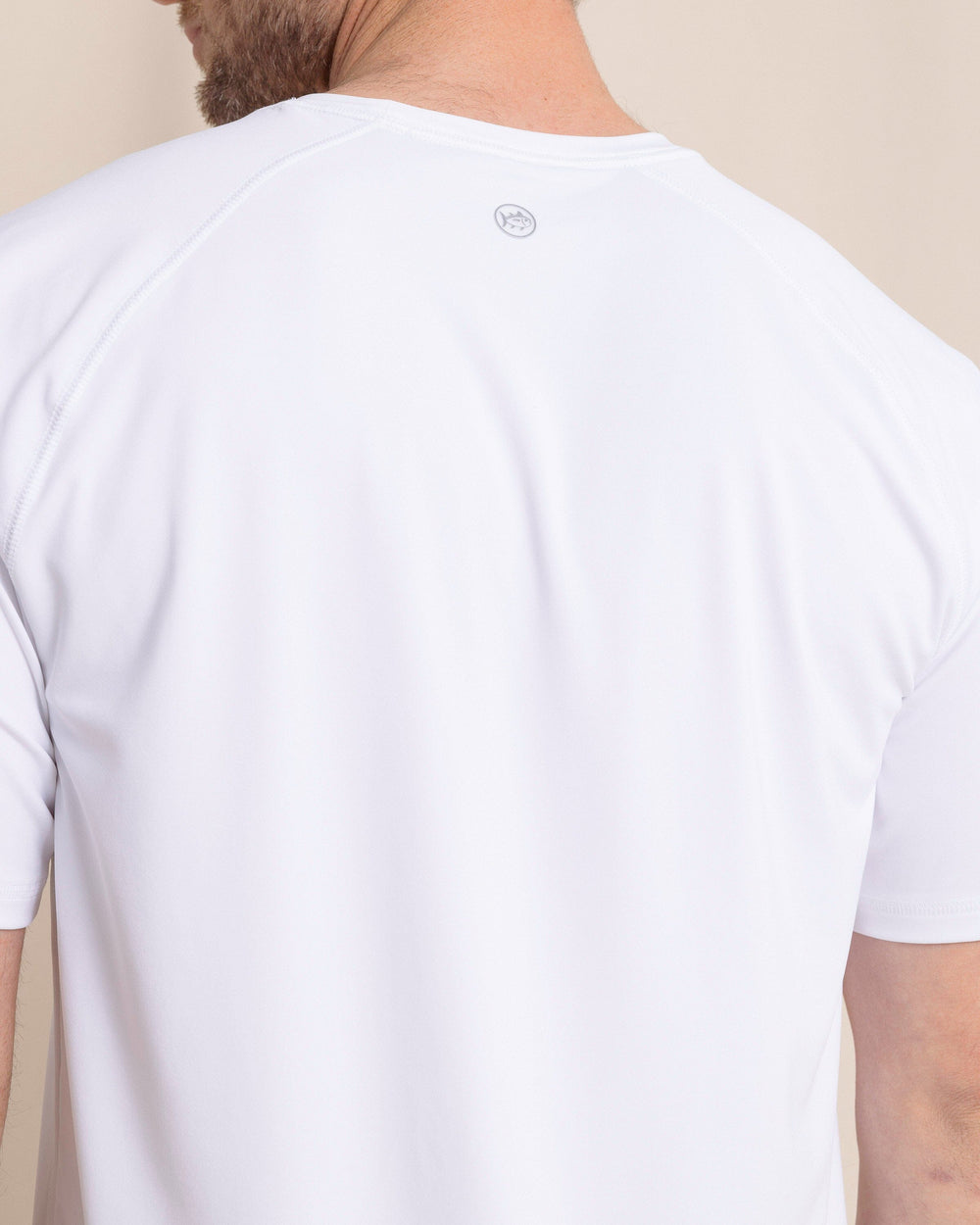 The back detail view of the Southern Tide brrr°®-illiant Performance T-Shirt by Southern Tide - Classic White