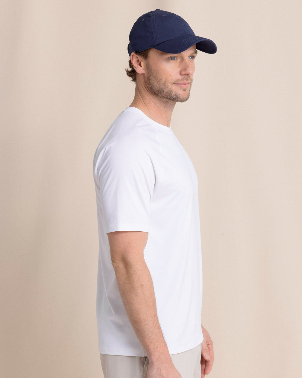 The side view of the Southern Tide brrr°®-illiant Performance T-Shirt by Southern Tide - Classic White