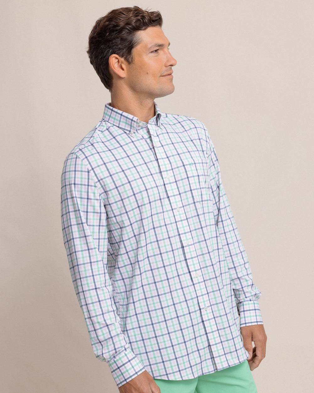 The side view of the Southern Tide Brrr Intercoastal Glenmoor Plaid Long Sleeve Sport Shirt by Southern Tide - Parfait Pink