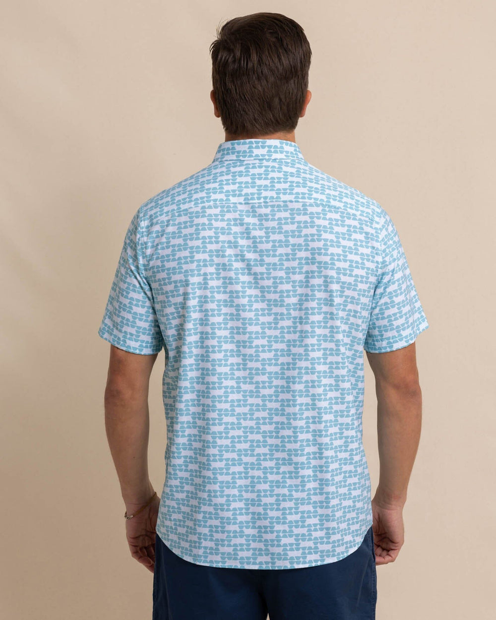 The back view of the Southern Tide brrr Intercoastal Heather Stay Shady Short Sleeve Sport Shirt by Southern Tide - Heather Wake Blue