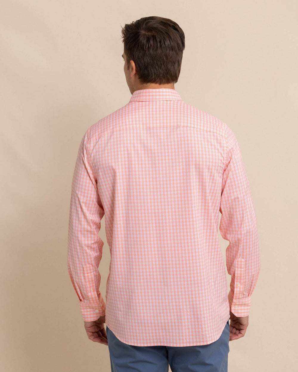 The back view of the Southern Tide brrr Intercoastal Poinsett Plaid Long Sleeve Sport Shirt by Southern Tide - Desert Flower Coral