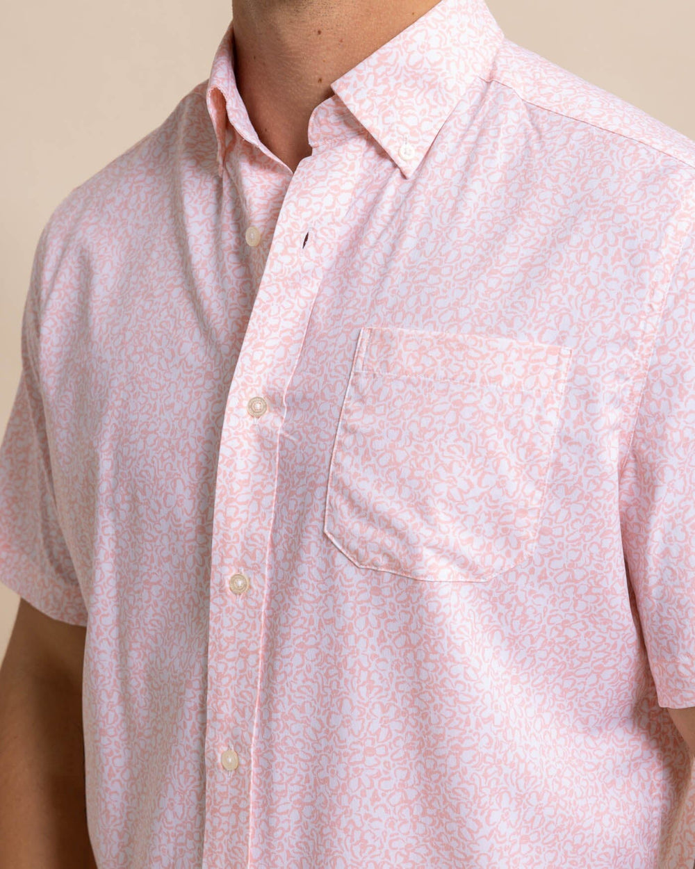 The detail view of the Southern Tide brrr Intercoastal That Floral Feeling Short Sleeve Sport Shirt by Southern Tide - Apricot Blush Coral