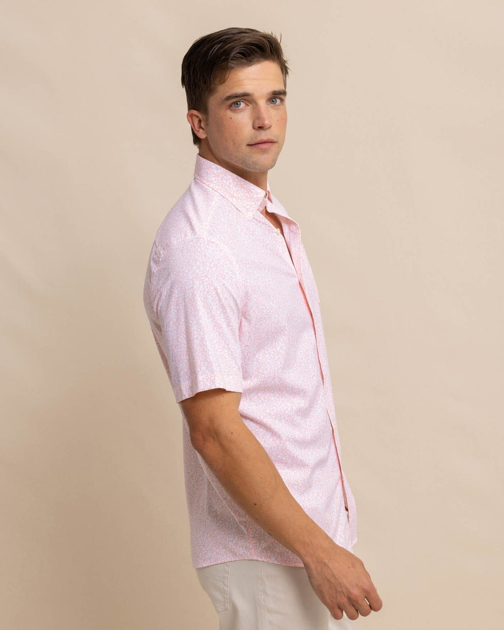 The front view of the Southern Tide brrr Intercoastal That Floral Feeling Short Sleeve Sport Shirt by Southern Tide - Apricot Blush Coral