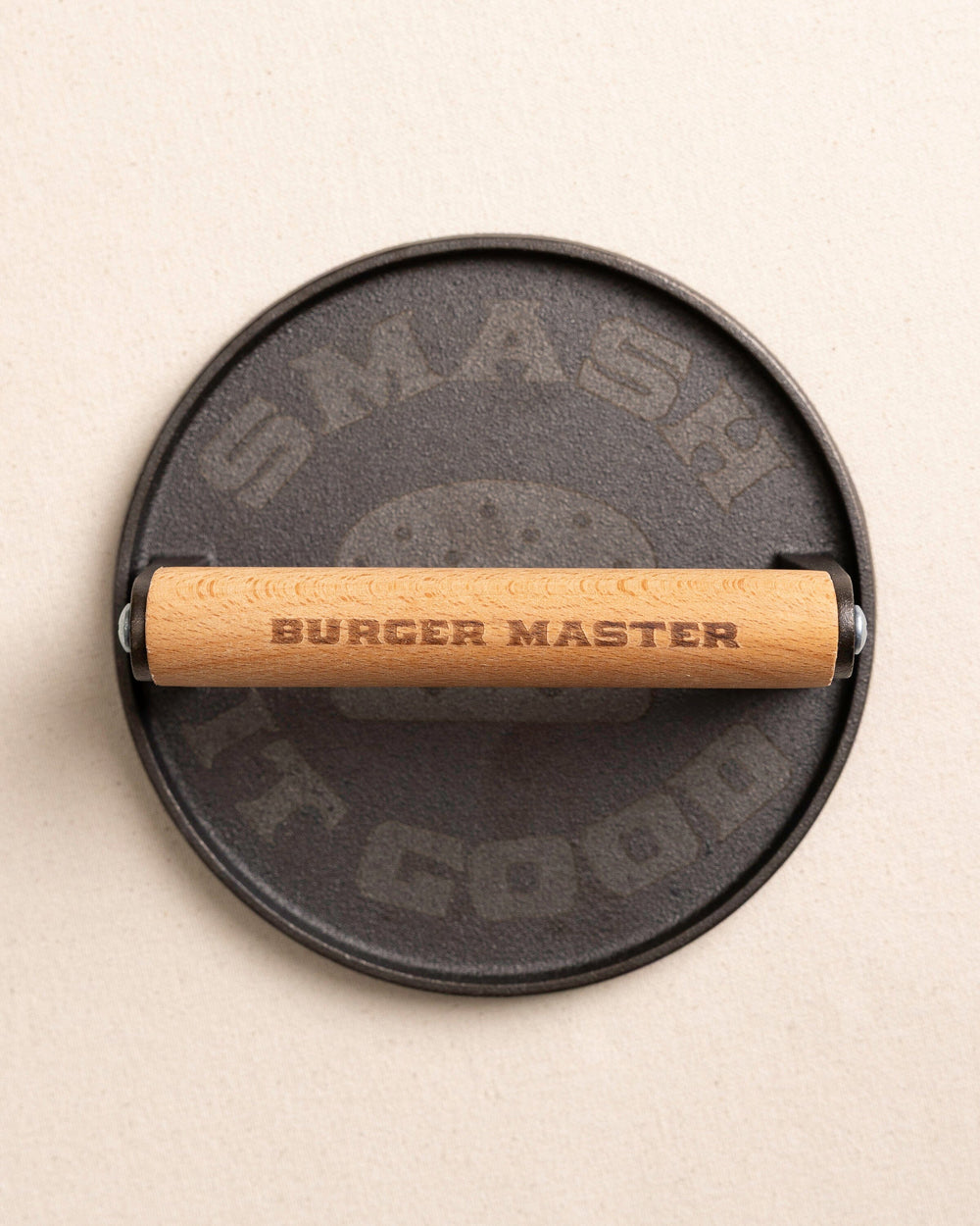 The top view of the Burger Master Cast Iron Grill Press at Southern Tide - Natural