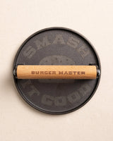 The top view of the Burger Master Cast Iron Grill Press at Southern Tide - Natural