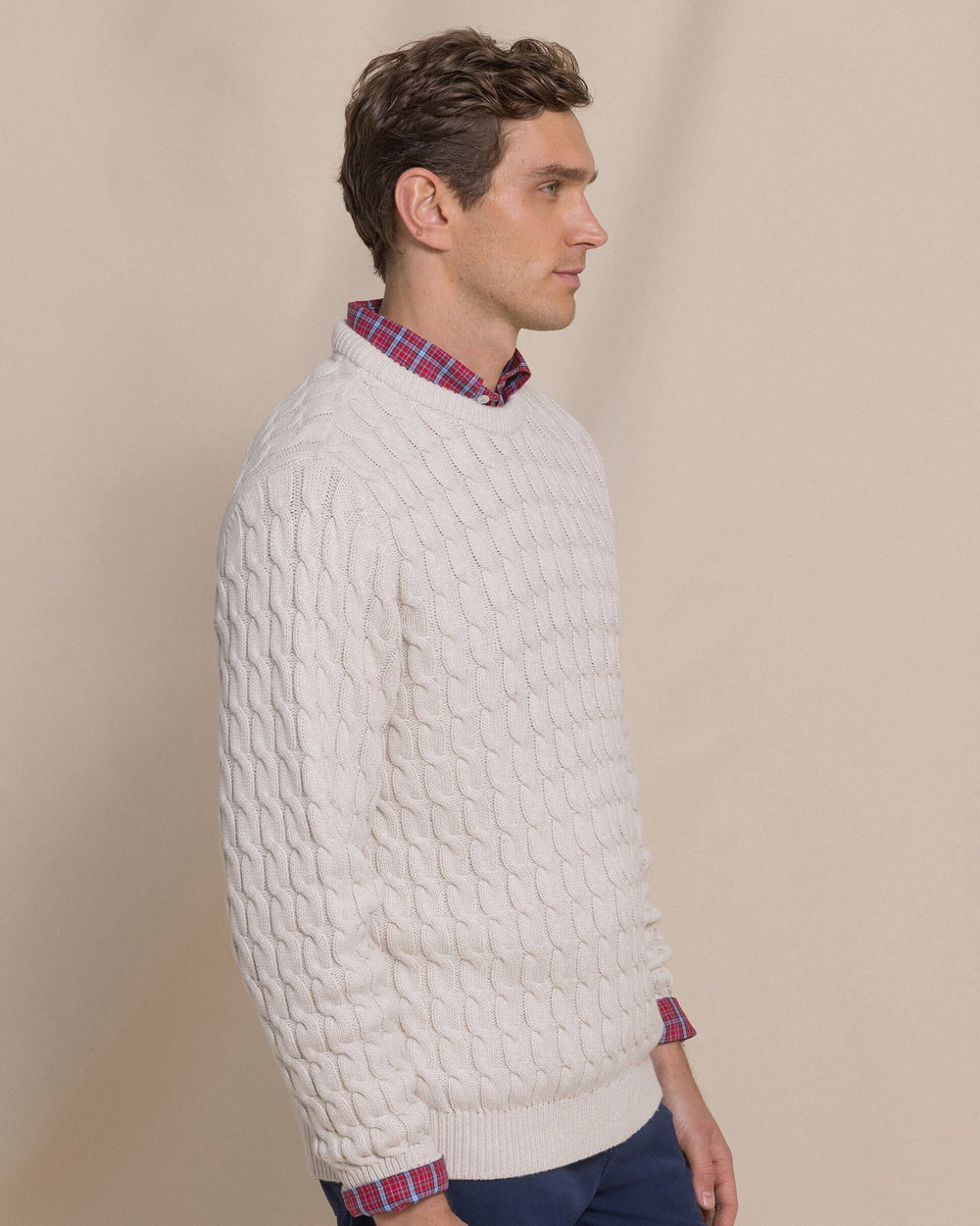 The side view of the Southern Tide Cable Knit Crew Sweater by Southern Tide - Star White