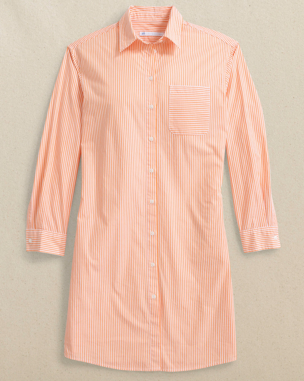 The front laydown view of the Southern Tide Cam Stripe Poplin Dress by Southern Tide - Peach Parfait