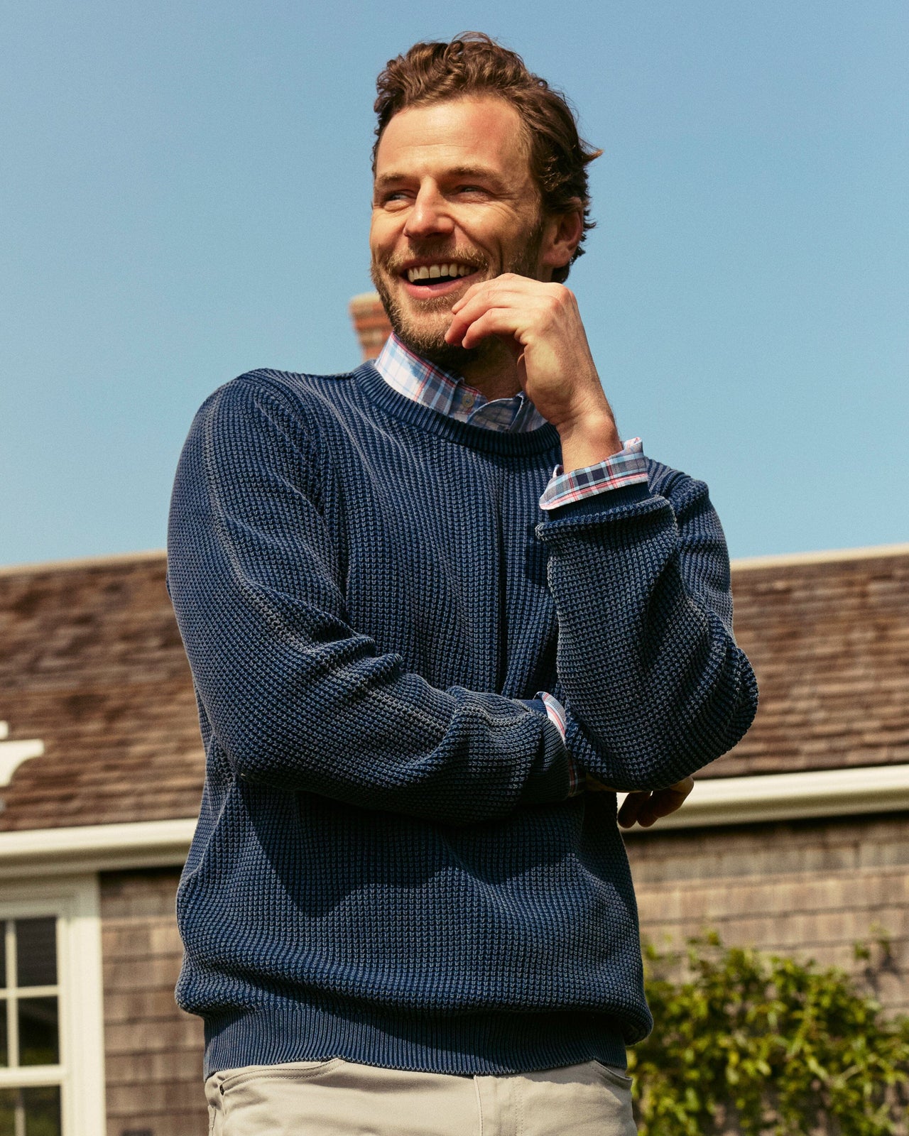 The lifestyle view of the Southern Tide Carrington Garment Dyed Crew Sweater by Southern Tide - Dress Blue