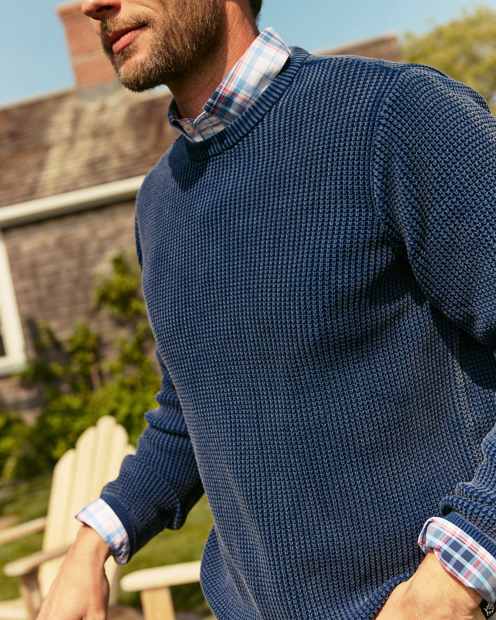 The lifestyle view of the Southern Tide Carrington Garment Dyed Crew Sweater by Southern Tide - Dress Blue