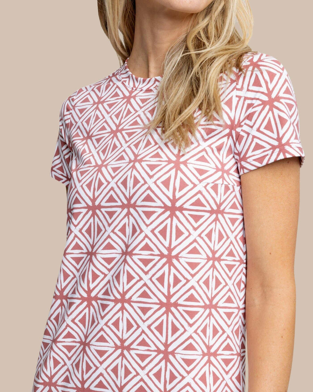 The detail view of the Southern Tide Chanelle Painted Geo Performance Dress by Southern Tide - Dusty Coral