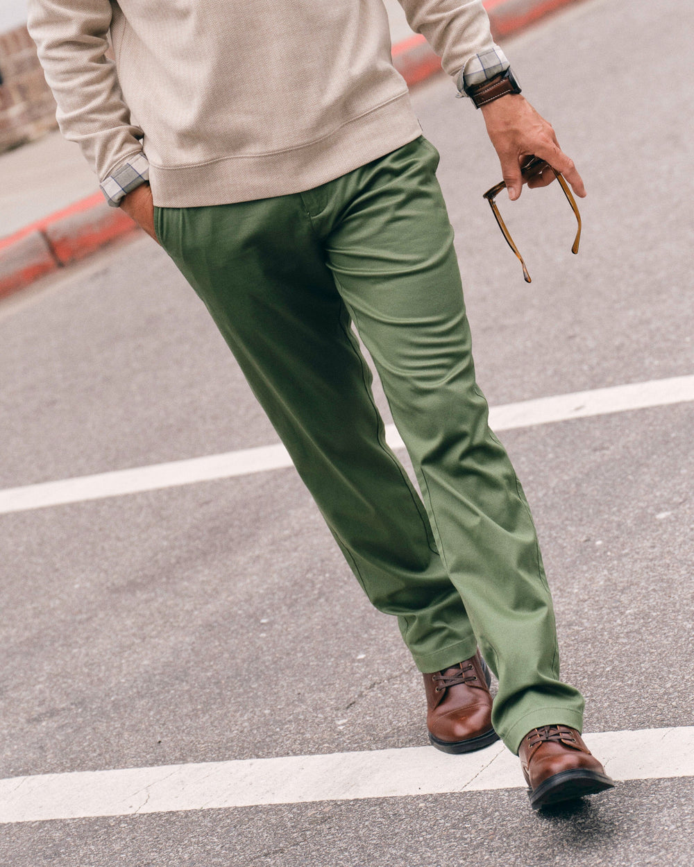 The lifestyle view of the Southern Tide Channel Marker Stretch Chino Pant by Southern Tide - Cedar Green
