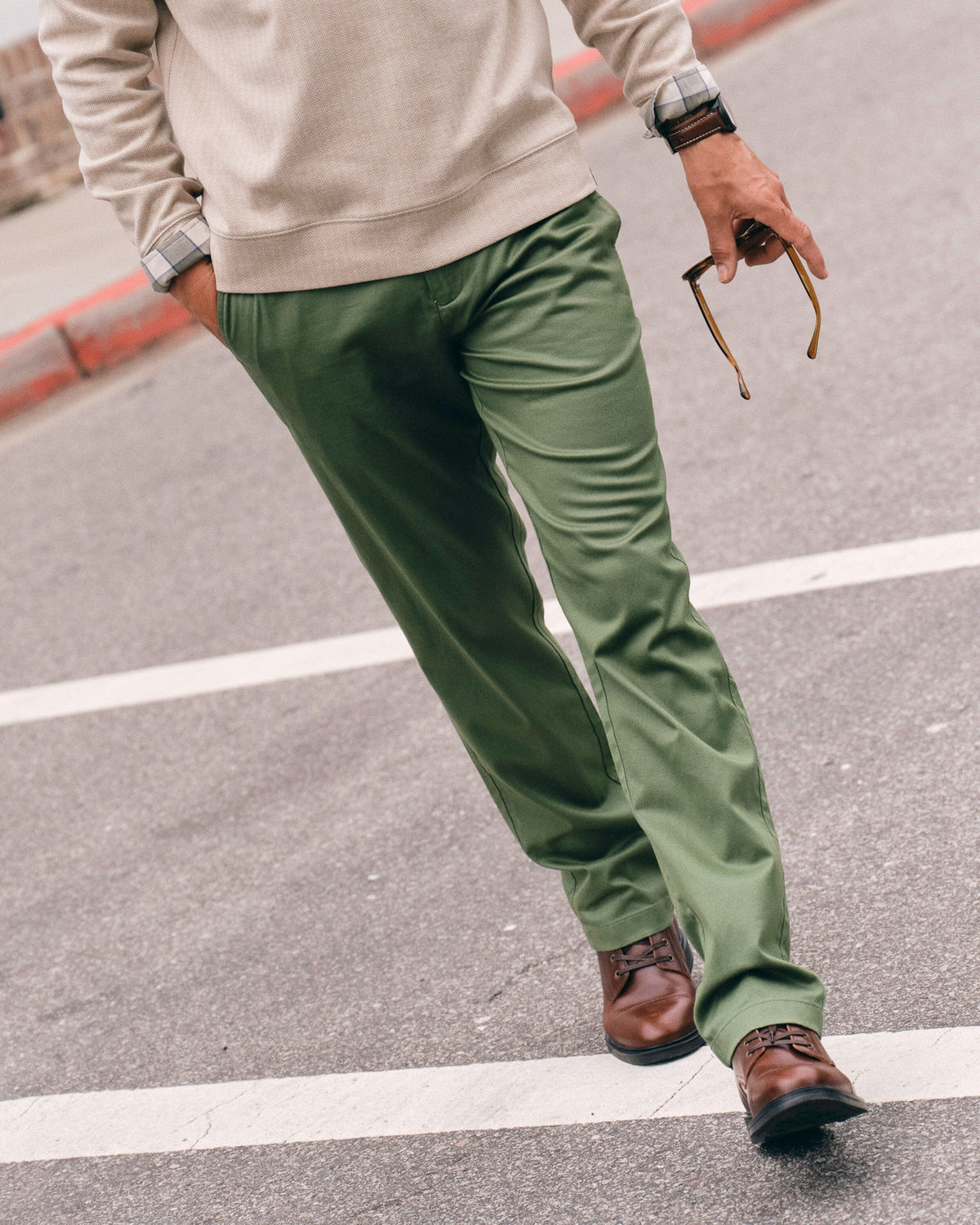 The lifestyle view of the Southern Tide Channel Marker Stretch Chino Pant by Southern Tide - Cedar Green