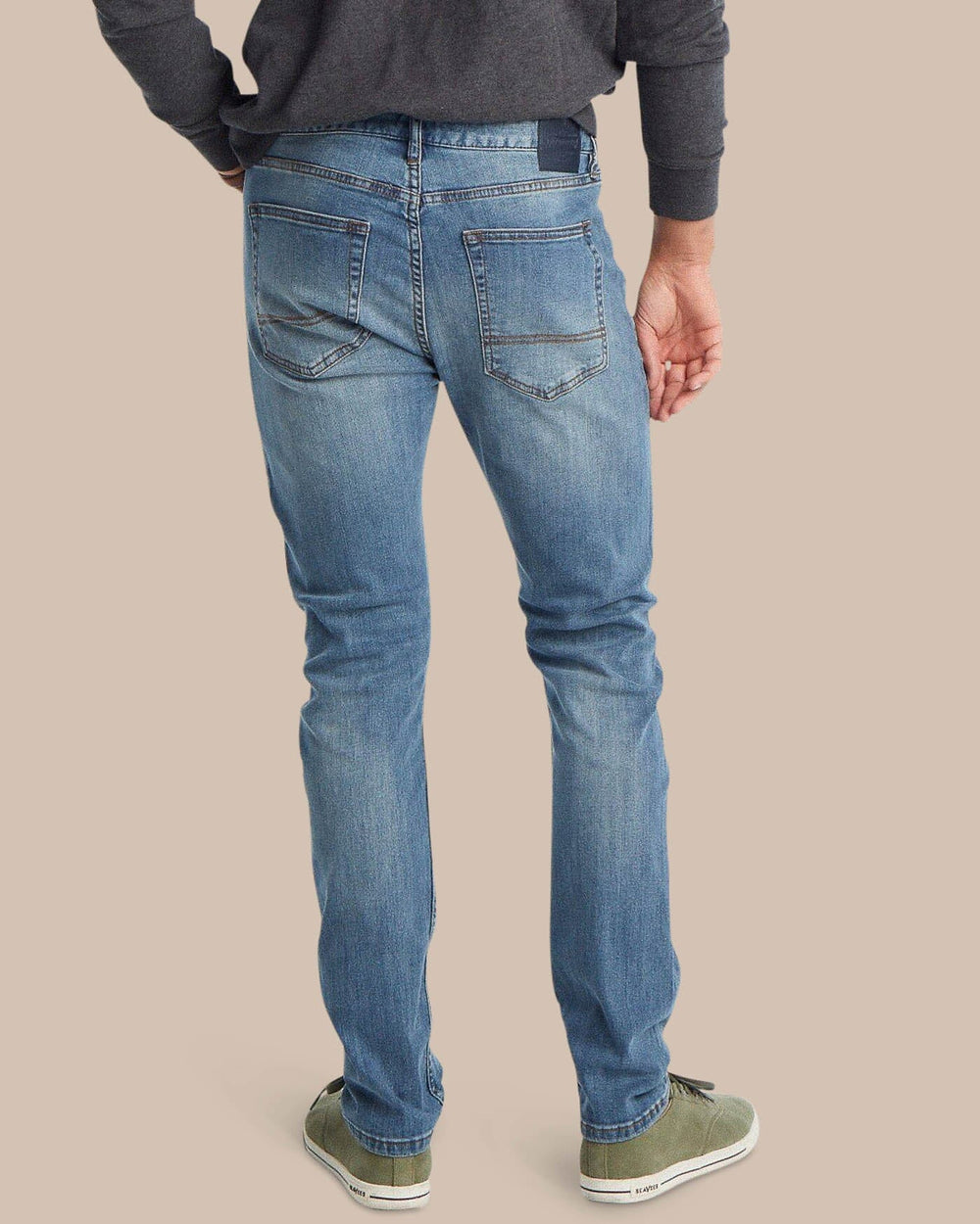 The back view of the Men's Blue Denim Charleston Denim Jeans by Southern Tide - Medium Wash