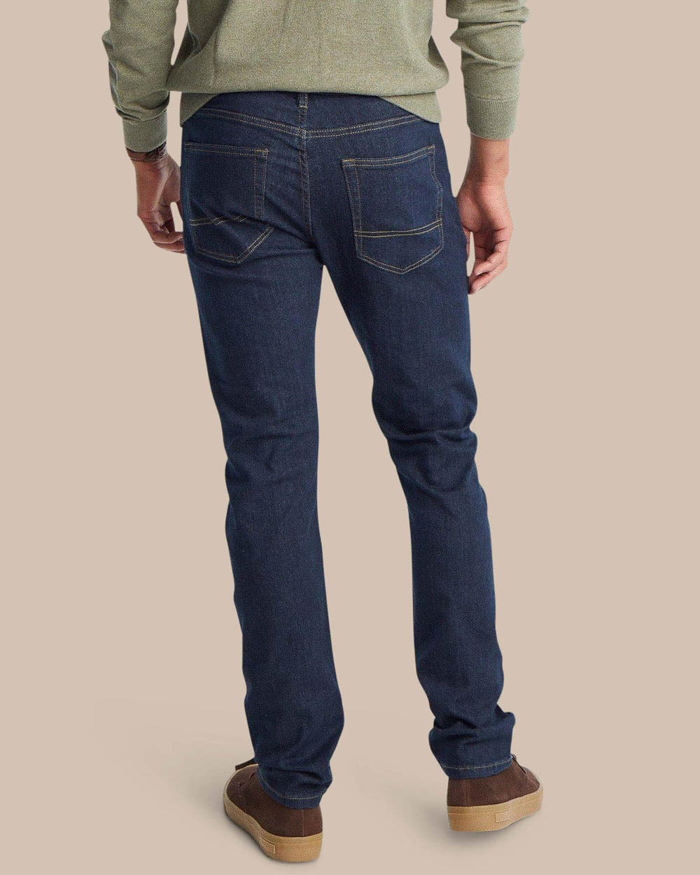 The back view of the Men's Blue Denim Charleston Denim Jeans by Southern Tide - Rinse