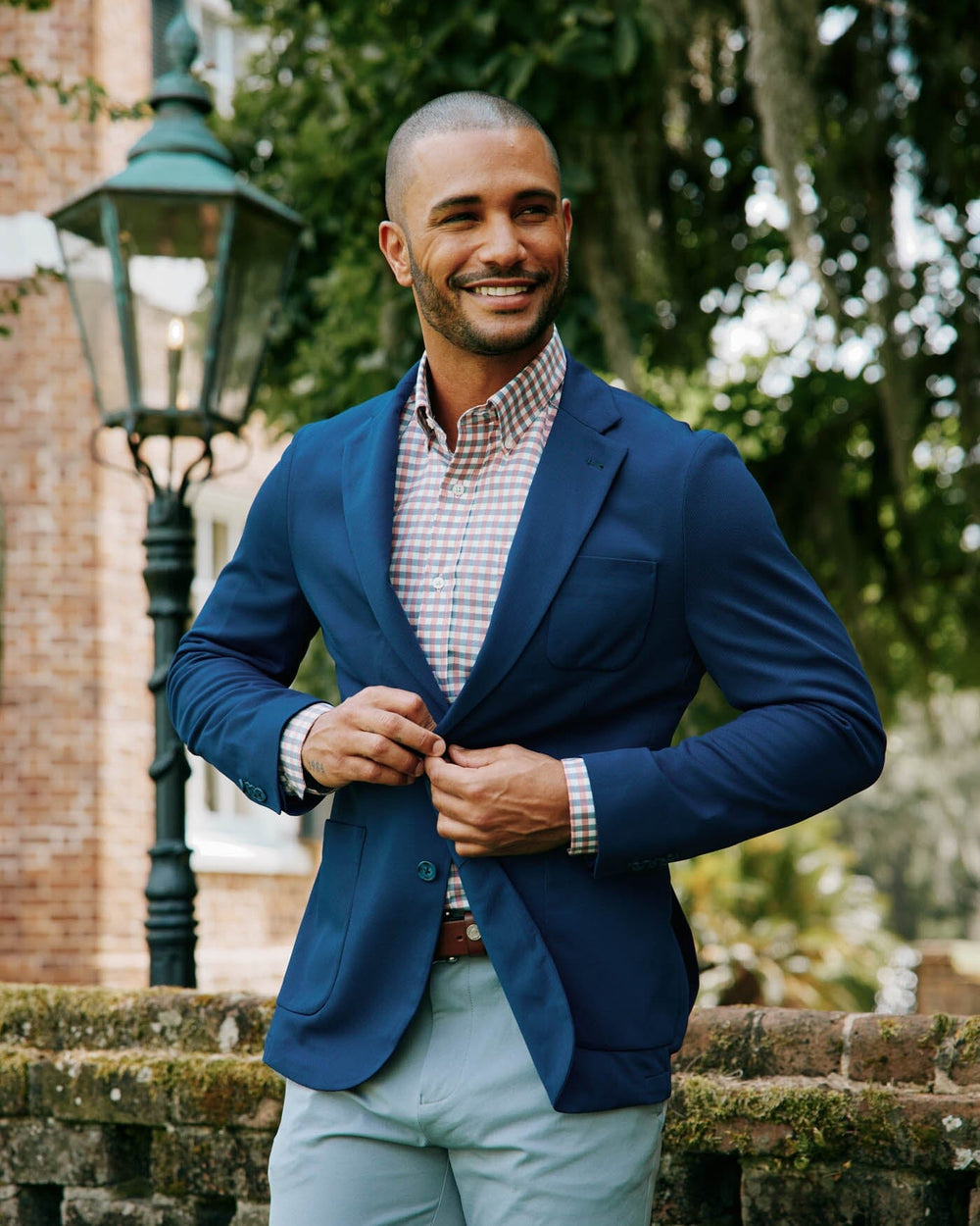 The fall lifestyle view of the Men's Charleston Navy Blazer by Southern Tide - Navy