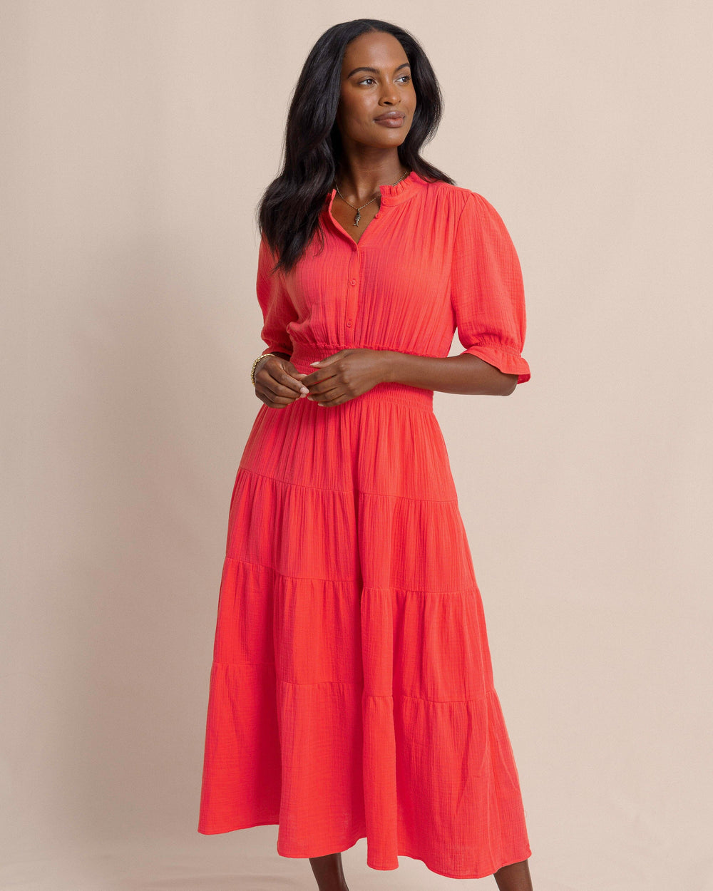 The front side view of the Southern Tide Christa Short Sleeve Maxi Dress by Southern Tide - Sunset Coral