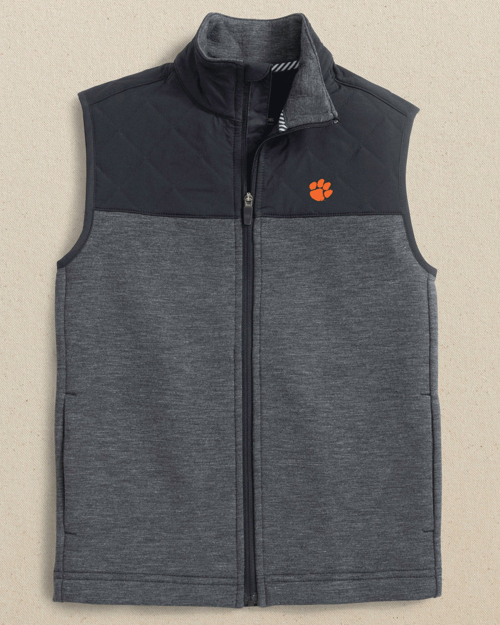 The front view of the Southern Tide Clemson Tigers Boys Waterfront Quilted Vest by Southern Tide - Caviar Black