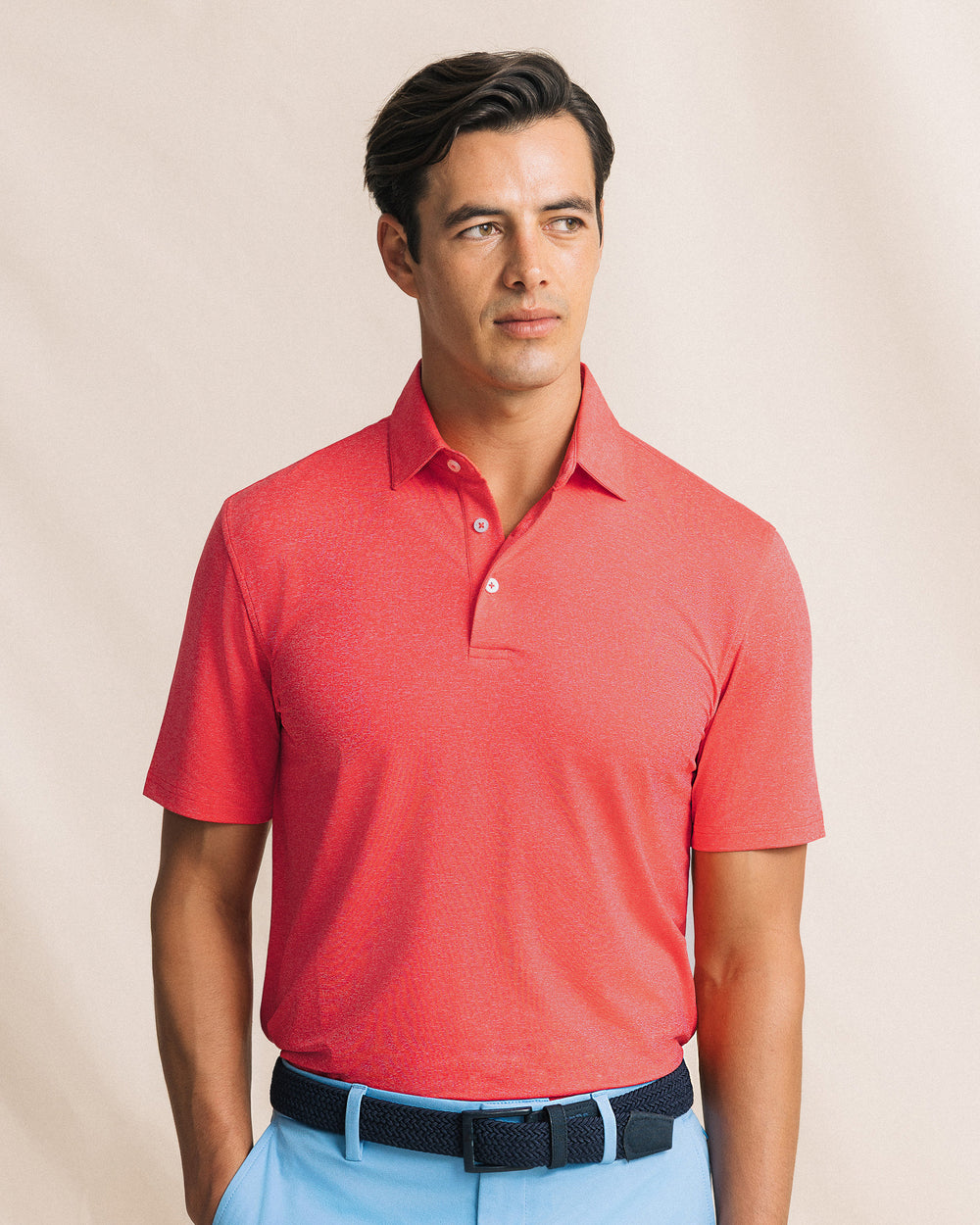 The front view of the Southern Tide Coastal Breeze® Heather Performance Polo by Southern Tide - Heather Channel Marker Red