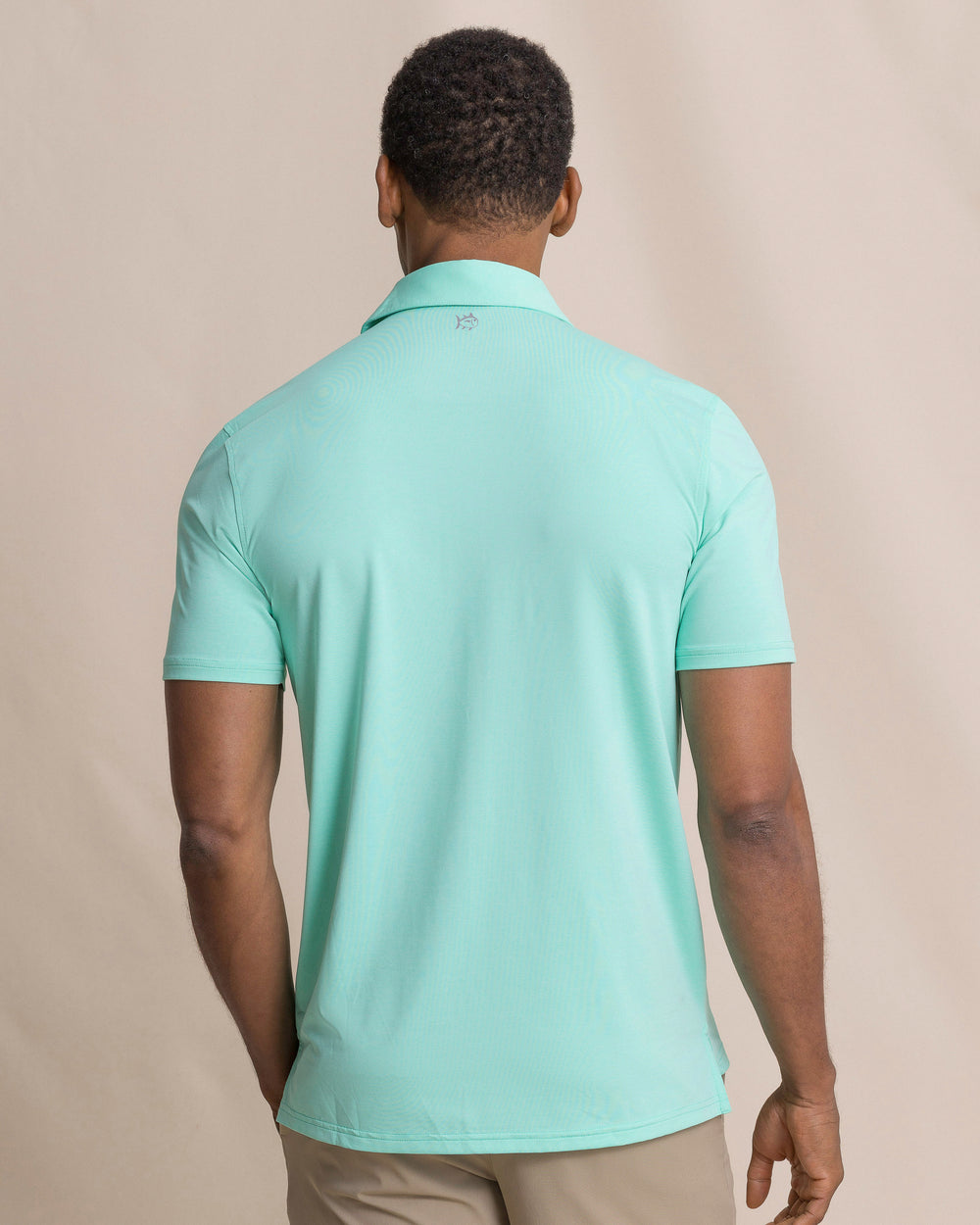 The back view of the Southern Tide Coastal Breeze® Heather Performance Polo by Southern Tide - Heather Gulf Shores