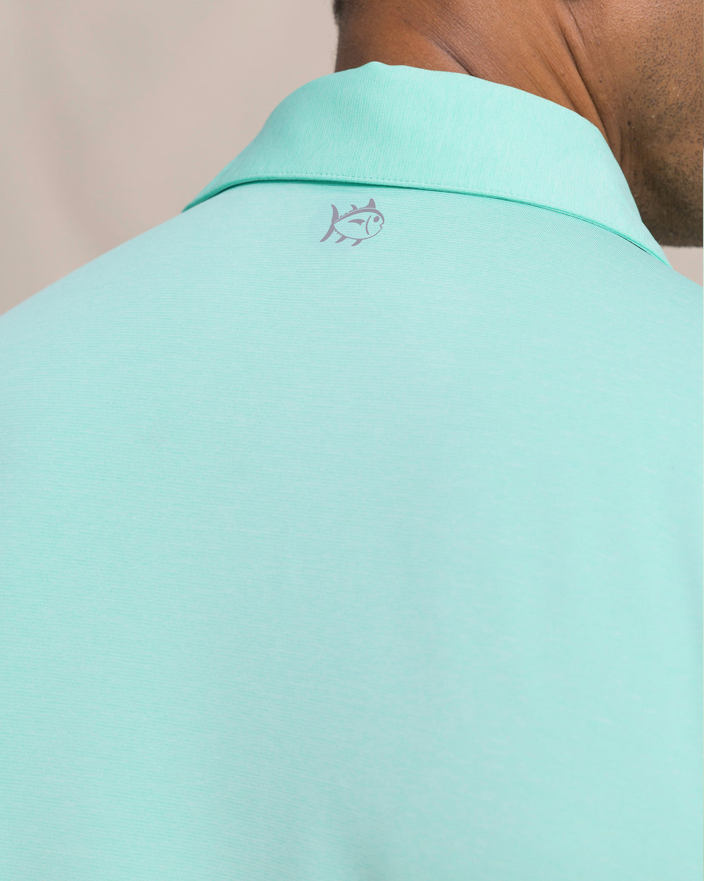 The detail view of the Southern Tide Coastal Breeze® Heather Performance Polo by Southern Tide - Heather Gulf Shores
