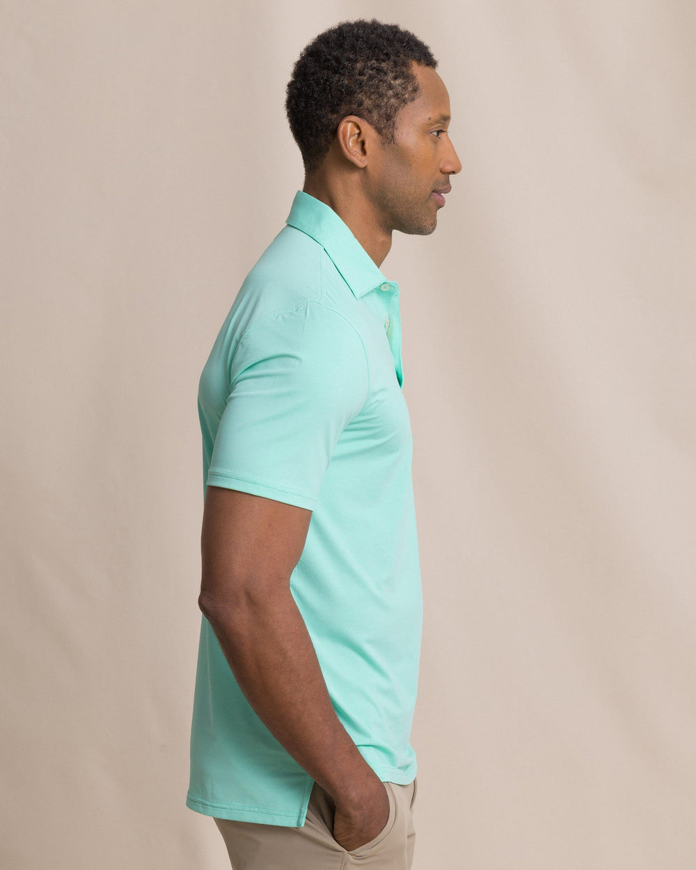 The side view of the Southern Tide Coastal Breeze® Heather Performance Polo by Southern Tide - Heather Gulf Shores