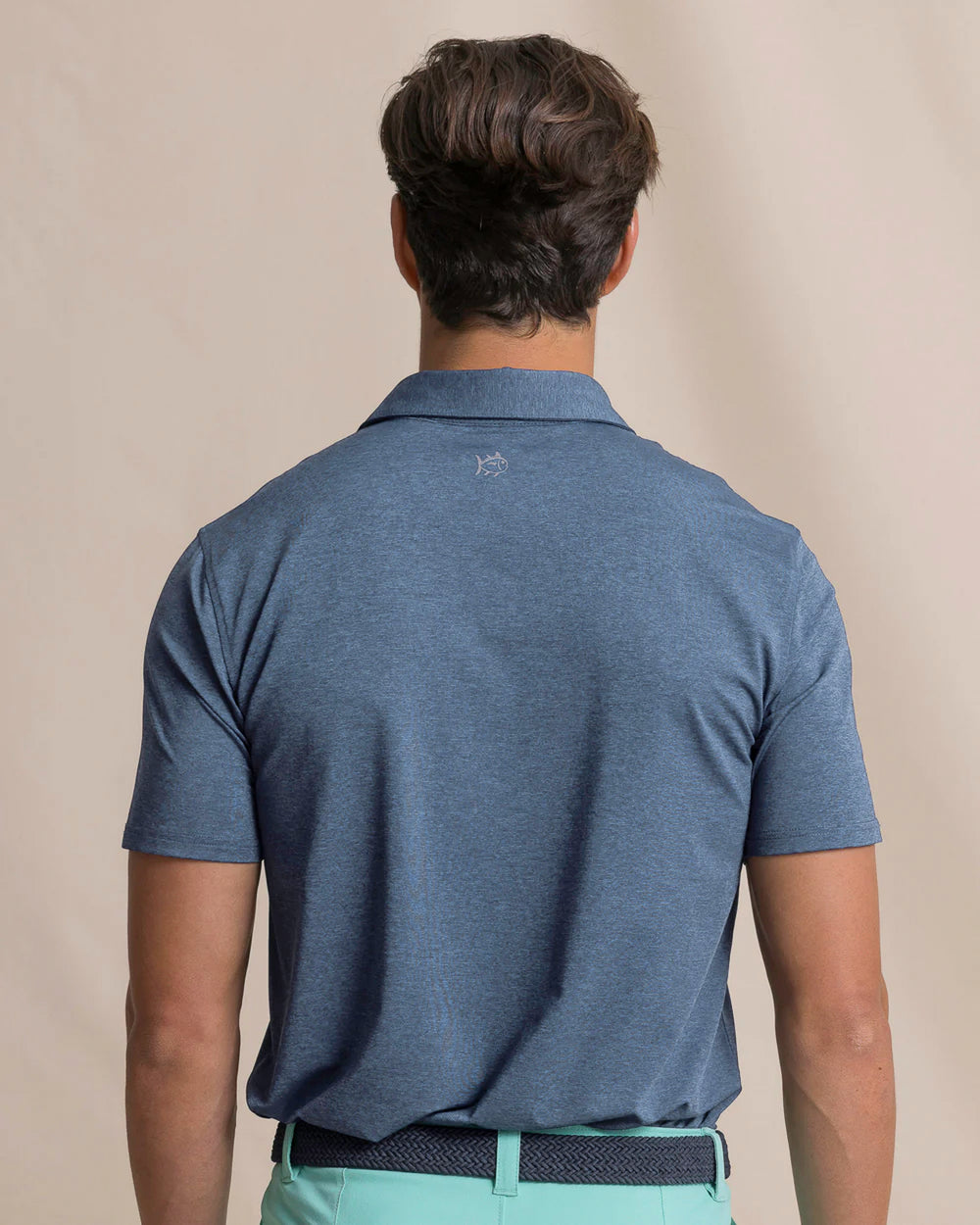 The back view of the Southern Tide Coastal Breeze® Heather Performance Polo by Southern Tide - Heather Nautical Blue