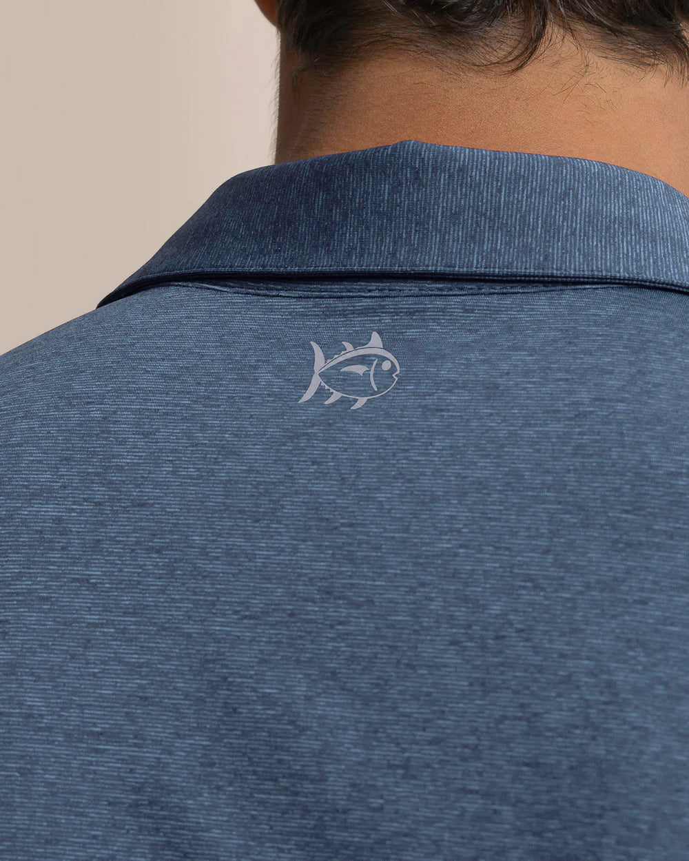 The back detail view of the Southern Tide Coastal Breeze® Heather Performance Polo by Southern Tide - Heather Nautical Blue