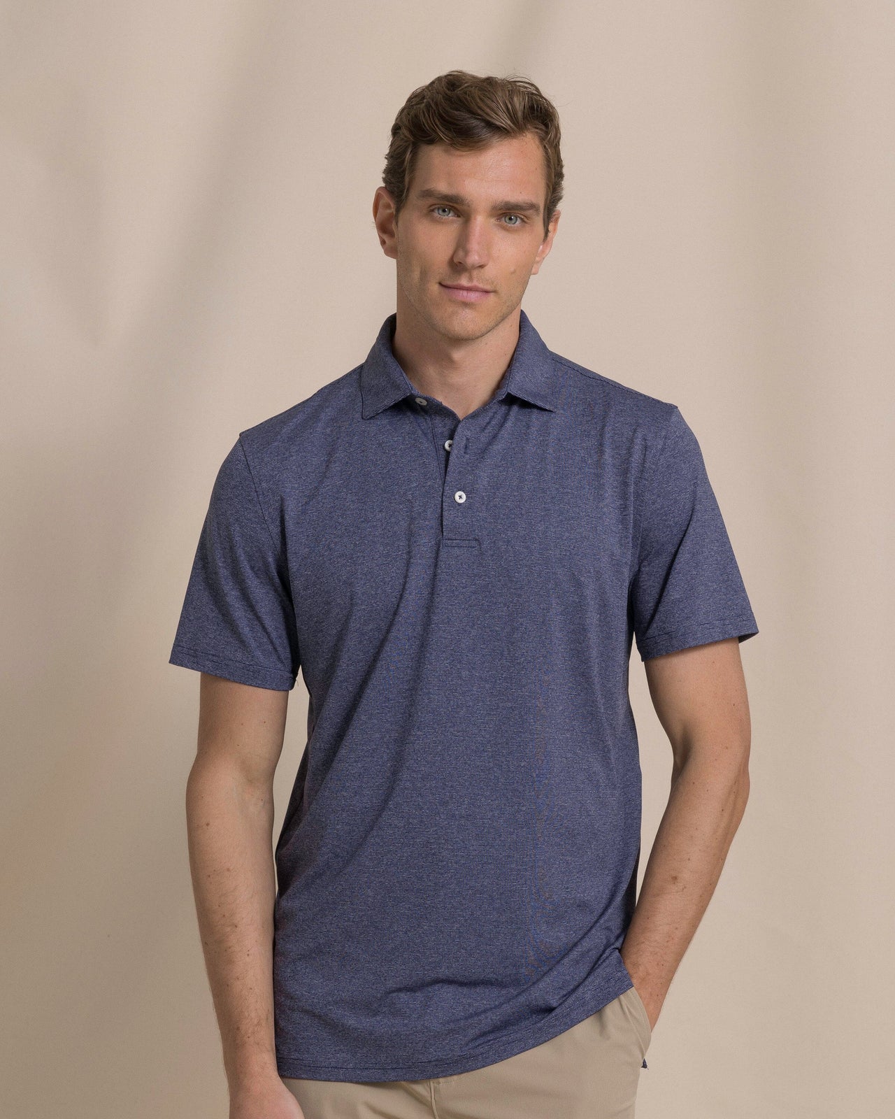 The front view of the Southern Tide Coastal Breeze® Heather Performance Polo by Southern Tide - Heather Nautical Navy