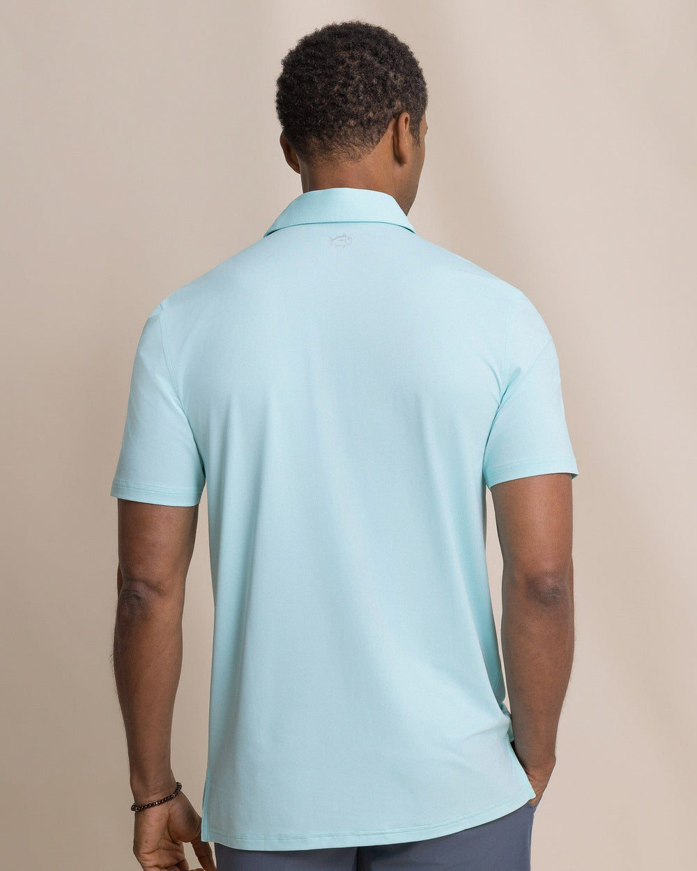 The back view of the Southern Tide Coastal Breeze® Heather Performance Polo by Southern Tide - Heather Shore Blue