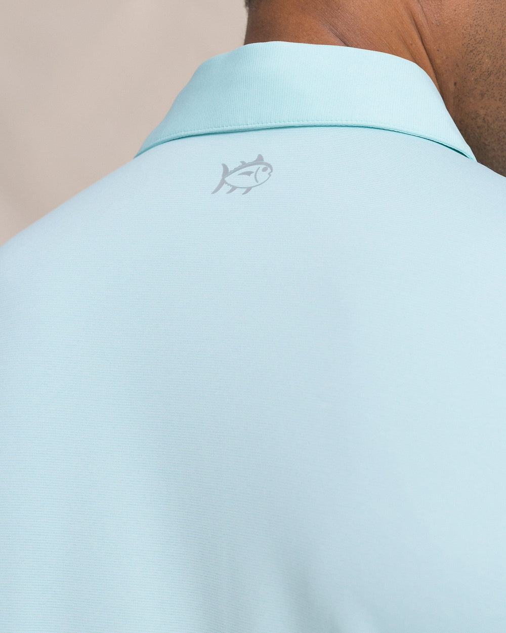 The detail view of the Southern Tide Coastal Breeze® Heather Performance Polo by Southern Tide - Heather Shore Blue